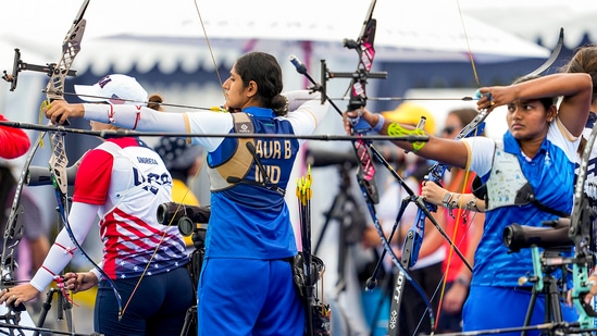 India's archers Bhajan Kaur (C) and Ankita Bhakat (R) during women's individual ranking round at the Summer Olympics 2024, at Gardens of Les Invalides, in Paris,

