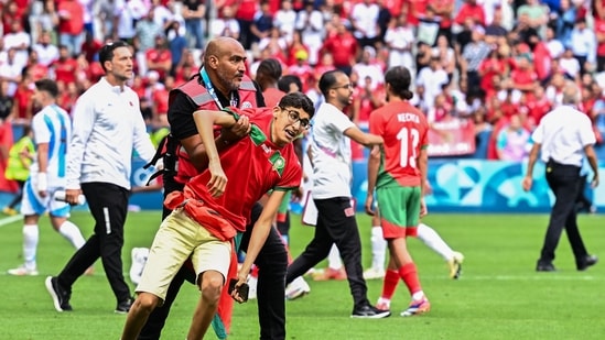 The crowd was told to leave the stadium, but players remained at the venue and returned to the pitch for a final three minutes of added time in front of empty stands.(AFP)