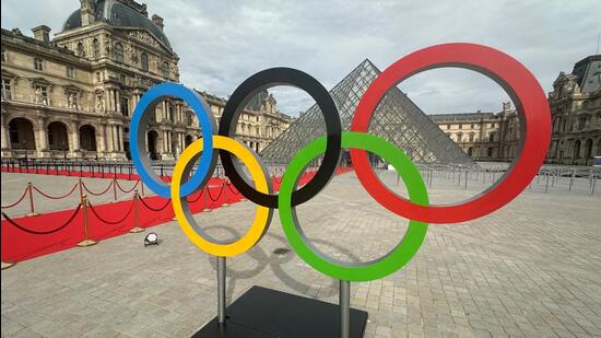 The Olympic rings are seen at the entrance of the Louvre Museum. (REUTERS)