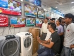 Noida, India- July 23, 2024: People watching the live telecast of Union Budget 2024, at a shop in Sector 51. Finance Minister Nirmala Sitharaman presented Union Budget of the Modi government, in Noida, India, on Tuesday, July 23, 2024. (Photo by Sunil Ghosh / Hindustan Times) Noida, India- July 23, 2024: People watching the live telecast of Union Budget 2024, at a shop in Sector 51. Finance Minister Nirmala Sitharaman presented Union Budget of the Modi government, in Noida, India, on Tuesday, July 23, 2024. (Photo by Sunil Ghosh / Hindustan Times)