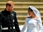 Prince Harry and Meghan Markle walk down the steps after their wedding. Prince Harry and Meghan Markle walk down the steps after their wedding.