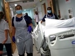 UK hospital cyber attack: Medical staff transfer a patient along a corridor at the Royal Blackburn Teaching Hospital in Blackburn, north-west England.(AFP) UK hospital cyber attack: Medical staff transfer a patient along a corridor at the Royal Blackburn Teaching Hospital in Blackburn, north-west England.(AFP)