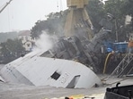Indian Navy frigate INS Brahmaputra lies tilted to one side (port side) inside the Mumbai naval dockyard. (ANI Photo) Indian Navy frigate INS Brahmaputra lies tilted to one side (port side) inside the Mumbai naval dockyard. (ANI Photo)