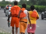 Kanwariyas carrying holy water collected from River Ganga in Haridwar walk back to their hometowns. (Parveen Kumar/ HT Photo) Kanwariyas carrying holy water collected from River Ganga in Haridwar walk back to their hometowns. (Parveen Kumar/ HT Photo)