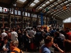 People wait at Gare de Lille-Flandres train station, after a series of coordinated actions on France's high-speed train network that brought major disruption, ahead of the Paris 2024 Olympics opening ceremony, in Lille, France, July 26, 2024. Paris travel alert: Trains hit by sabotage hours before Olympics kick off 
