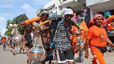 Kanwariyas (Shiva devotees) carry pots filled with water collected from Gangariver during the annual 'Kanwar Yatra', in Haridwar on Thursday. (ANI Photo) (Princess Ilvita) Kanwariyas (Shiva devotees) carry pots filled with water collected from Gangariver during the annual 'Kanwar Yatra', in Haridwar on Thursday. (ANI Photo) (Princess Ilvita)