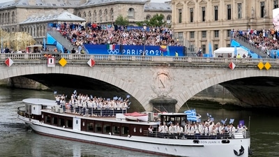 Greece's team goes down the Seine River in Paris, France, during the opening ceremony of the 2024 Summer Olympics, Friday, July 26, 2024. AP/PTI(AP07_26_2024_000521A) (AP) Greece's team goes down the Seine River in Paris, France, during the opening ceremony of the 2024 Summer Olympics, Friday, July 26, 2024. AP/PTI(AP07_26_2024_000521A) (AP)