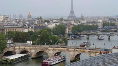 The Eiffel Tower gives backdrop to athletes riding on boats along the Seine River in Paris, France, during the opening ceremony for the 2024 Summer Olympics, Friday, July 26, 2024. AP/PTI(AP07_26_2024_000524A) (AP) The Eiffel Tower gives backdrop to athletes riding on boats along the Seine River in Paris, France, during the opening ceremony for the 2024 Summer Olympics, Friday, July 26, 2024. AP/PTI(AP07_26_2024_000524A) (AP)