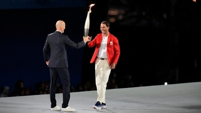 Zinedine Zidane hands the torch over to Rafael Nadal, right, in Paris, France, during the opening ceremony of the 2024 Summer Olympics, Friday, July 26, 2024. (AP Photo/Natacha Pisarenko) (AP) Zinedine Zidane hands the torch over to Rafael Nadal, right, in Paris, France, during the opening ceremony of the 2024 Summer Olympics, Friday, July 26, 2024. (AP Photo/Natacha Pisarenko) (AP)