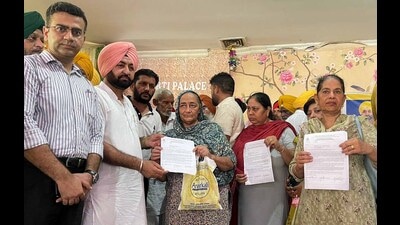 Officials handing over the letters for old-age pension to beneficiaries during the camp at Sahnewal. (HT File) Officials handing over the letters for old-age pension to beneficiaries during the camp at Sahnewal. (HT File)