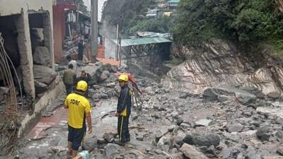 Officials said some vehicles were reported to have been buried in the debris after the rainfall. (HT photo)