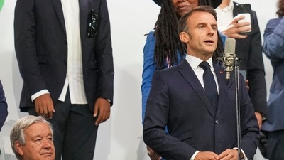 France President Emmanuel Macron seeks pin Paris, France, during the opening ceremony of the 2024 Summer Olympics, Friday, July 26, 2024. (AP Photo/Thibault Camus) (AP) France President Emmanuel Macron seeks pin Paris, France, during the opening ceremony of the 2024 Summer Olympics, Friday, July 26, 2024. (AP Photo/Thibault Camus) (AP)