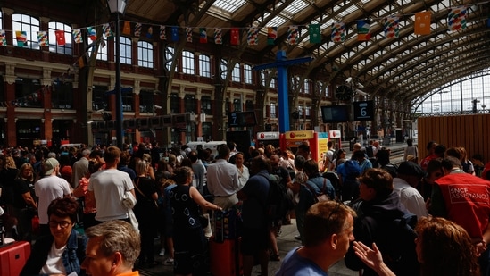 People wait at Gare de Lille-Flandres train station, after a series of coordinated actions on France's high-speed train network that brought major disruption, ahead of the Paris 2024 Olympics opening ceremony, in Lille, France, July 26, 2024. Paris travel alert: Trains hit by sabotage hours before Olympics kick off (Photo by REUTERS/Evelyn Hockstein)