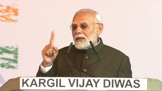 Prime Minister Narendra Modi speaks during a program to commemorate the 25th anniversary of the Kargil Vijay Diwas at the Kargil War Memorial in Drass on Friday. (PTI Photo)(PTI)