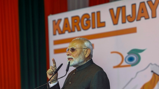  Prime Minister Narendra Modi speaks during an event to commemorate the 25th anniversary of Kargil Vijay Diwas at the Kargil War Memorial in Drass, (PTI Photo) (PTI)