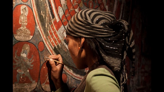 Karsang Choeten is one of the 30 women working on the monastery walls. Karsang Choeten is one of the 30 women working on the monastery walls.