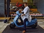 Bhavish Aggarwal, Co-founder and CEO of Ola, poses for a photograph with the new Ola electric scooter during its launch at the Ola headquarters in Bangalore on August 15, 2021. (AFP) Bhavish Aggarwal, Co-founder and CEO of Ola, poses for a photograph with the new Ola electric scooter during its launch at the Ola headquarters in Bangalore on August 15, 2021. (AFP)