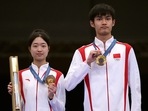 Gold medallists Yuting Huang (L) of China and  Lihao Sheng of China pose with their medals.