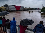 Pune: People watch an overflowing Mutha river following heavy rainfall, in Pune district, Thursday, July 25, 2024. (PTI) Pune: People watch an overflowing Mutha river following heavy rainfall, in Pune district, Thursday, July 25, 2024. (PTI)