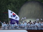Olympics 2024: Athletes of South Korea aboard a boat in the floating parade on the river Seine during the opening ceremony.(Reuters)
