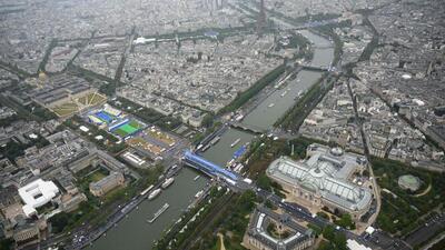 A photograph taken from an helicopter shows an aerial view of delegation boats navigating down the Seine during the opening ceremony. (AFP) A photograph taken from an helicopter shows an aerial view of delegation boats navigating down the Seine during the opening ceremony. (AFP)