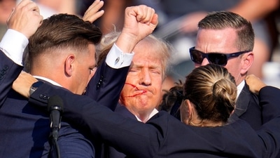 Republican presidential candidate former President Donald Trump is helped off the stage by U.S. Secret Service agents at a campaign event in Butler, Pa., on Saturday, July 13, 2024. (AP Photo/Gene J. Puskar) (AP) Republican presidential candidate former President Donald Trump is helped off the stage by U.S. Secret Service agents at a campaign event in Butler, Pa., on Saturday, July 13, 2024. (AP Photo/Gene J. Puskar) (AP)