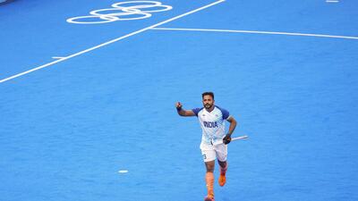 India's Harmanpreet Singh celebrates after scoring a goal from a penalty stroke against New Zealand on Saturday. (PTI)