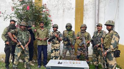 Jammu and Kashmir Police and Border Security Force (BSF) arrested militants and recovered arms, ammunition and explosives at a joint checkpoint was established at Reddi Chowkibal market, in Kupwara in June. (ANI) Jammu and Kashmir Police and Border Security Force (BSF) arrested militants and recovered arms, ammunition and explosives at a joint checkpoint was established at Reddi Chowkibal market, in Kupwara in June. (ANI)