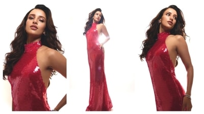 Triptii Dimri turns up the heat in this shimmery, sequin backless halter neck dress. She radiated with a dreamy charm with her wavy hair and full-glam makeup. (Instagram@/tripti_dimri) Triptii Dimri turns up the heat in this shimmery, sequin backless halter neck dress. She radiated with a dreamy charm with her wavy hair and full-glam makeup. (Instagram@/tripti_dimri)