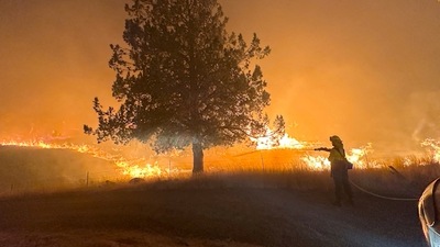A firefighter works to extinguish the Lone Rock fire burning in Spray, Oregon, U.S. July 21, 2024 in this screengrab obtained from a video. Oregon State Fire Marshal/Handout via REUTERS/File Photo (via REUTERS)