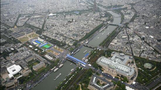 A photograph taken from an helicopter shows an aerial view of delegation boats navigating down the Seine during the opening ceremony. (AFP)