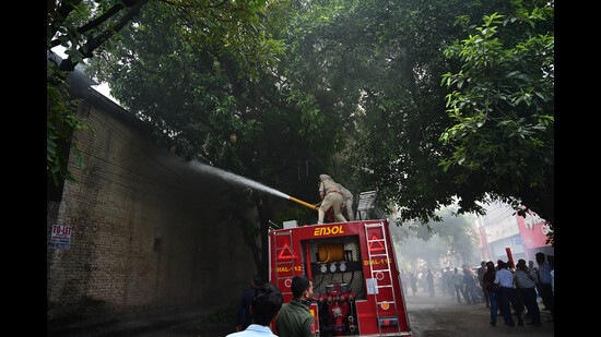 Fire fighters trying to control fire at Industrial Area, Phase 2, Chandigarh, on Saturday. (Ravi Kumar/HT) Fire fighters trying to control fire at Industrial Area, Phase 2, Chandigarh, on Saturday. (Ravi Kumar/HT)