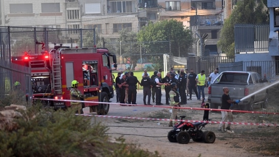 Israeli officials respond after rockets were launched across Lebanon’s border with Israel which, according to Israel’s ambulance services critically injured multiple people at a soccer pitch in Majdal Shams, a Druze village in the Israeli-occupied Golan Heights, July 27 2024. (REUTERS)