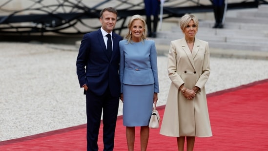 First lady Jill Biden welcomed by French President Emmanuel Macron and his wife Brigitte Macron at the Elysee Palace ahead of an opening ceremony.(AP)