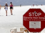 A stop sign warns tourists of extreme heat at Badwater Basin in Death Valley National Park, California. Tourists defy heatwave warnings by US to capture Death Valley's unique landscape. (Photo by Daniel Jacobi II/Las Vegas Review-Journal via AP) A stop sign warns tourists of extreme heat at Badwater Basin in Death Valley National Park, California. Tourists defy heatwave warnings by US to capture Death Valley's unique landscape. (Photo by Daniel Jacobi II/Las Vegas Review-Journal via AP)