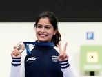 India's Manu Bhaker poses for a photograph with her bronze medal after finish third in the 10m air pistol women's final round at the 2024 Summer Olympics, Sunday, July 28, 2024, in Chateauroux, France. Oh Ye-Jin won the gold medal while Kim Yeji won the silver in the competition. (AP Photo/Manish Swarup)