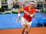 Spain's Rafael Nadal playing with Spain's Carlos Alcaraz returns to Argentina's Maximo Gonzalez and Argentina's Andres Molteni during their men's doubles first round tennis match