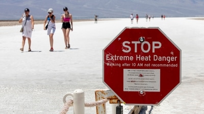 A stop sign warns tourists of extreme heat at Badwater Basin in Death Valley National Park, California. Tourists defy heatwave warnings by US to capture Death Valley's unique landscape. (Photo by Daniel Jacobi II/Las Vegas Review-Journal via AP) A stop sign warns tourists of extreme heat at Badwater Basin in Death Valley National Park, California. Tourists defy heatwave warnings by US to capture Death Valley's unique landscape. (Photo by Daniel Jacobi II/Las Vegas Review-Journal via AP)