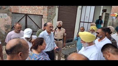 Congress MLA Rana Gurjit Singh interacts with officials and residents in Kapurthala on Sunday. (HT Photo)