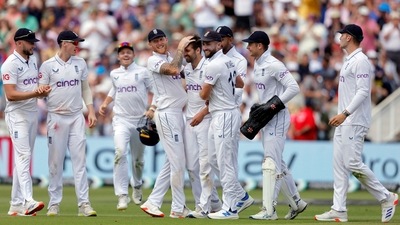 England's Mark Wood celebrates his five-wicket haul with teammates after taking the wicket of West Indies' Shamar Joseph, caught out by Harry Brook. (Reuters)