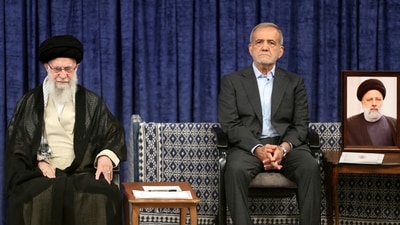 Iran's Supreme Leader Ayatollah Ali Khamenei and Iran's new president, Masoud Pezeshkian, attend an endorsement ceremony in Tehran, Iran, July 28, 2024. Office of the Iranian Supreme Leader (West Asia News Agency) (via REUTERS)