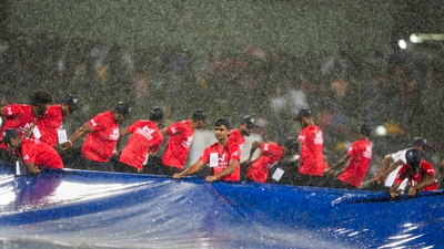 India's innings was just three balls old when sheets of rain came down on the stadium. It led to another long delay and this one ate into the overs. (PTI) India's innings was just three balls old when sheets of rain came down on the stadium. It led to another long delay and this one ate into the overs. (PTI)