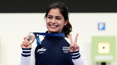 India's Manu Bhaker poses for a photograph with her bronze medal after finish third in the 10m air pistol women's final round at the 2024 Summer Olympics, Sunday, July 28, 2024, in Chateauroux, France. Oh Ye-Jin won the gold medal while Kim Yeji won the silver in the competition. (AP Photo/Manish Swarup) (AP) India's Manu Bhaker poses for a photograph with her bronze medal after finish third in the 10m air pistol women's final round at the 2024 Summer Olympics, Sunday, July 28, 2024, in Chateauroux, France. Oh Ye-Jin won the gold medal while Kim Yeji won the silver in the competition. (AP Photo/Manish Swarup) (AP)