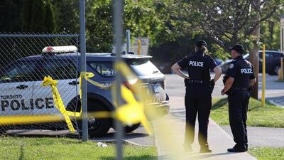 Police officers stand at the scene of a deadly shooting at an office building in the Don Mills neighbourhood of Toronto, Ontario, Canada on June 17, 2024. (REUTERS)