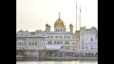 Twin Nishan Sahibs (Sikh Flags) fluttering near Akal Takht in complex of Golden Temple. Amritsar, India, on Sunday, July 28, 2024. (Sameer Sehgal/Hindustan Times)