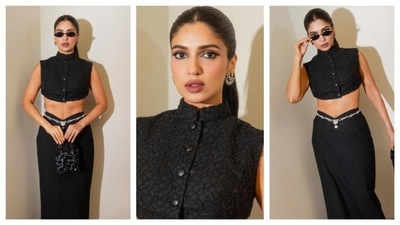 Bhumi Pednekar never fails to serve and slay her boss-lady looks. Draped in chic black overalls, she paired a buttoned-up crop top with a black skirt. With a waistchain complementing her skirt, she finished her look with cool shades and a high-glamour makeup look. This dress gave the vibe of a formal yet chic evening party wear. (Instagram/@bhumipednekar) Bhumi Pednekar never fails to serve and slay her boss-lady looks. Draped in chic black overalls, she paired a buttoned-up crop top with a black skirt. With a waistchain complementing her skirt, she finished her look with cool shades and a high-glamour makeup look. This dress gave the vibe of a formal yet chic evening party wear. (Instagram/@bhumipednekar)