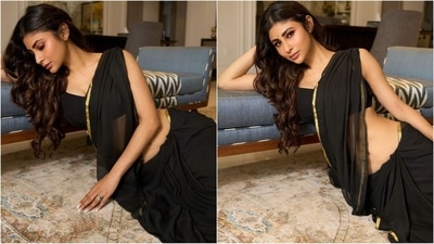 She paired her saree with a matching blouse that had a sweetheart neckline and a low back with a striking tie on the deatiling adding a touch of oomph factor. (Instagram/@imouniroy) She paired her saree with a matching blouse that had a sweetheart neckline and a low back with a striking tie on the deatiling adding a touch of oomph factor. (Instagram/@imouniroy)