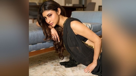 With a small black bindi on her forehead and massive diamond rings on her fingers, she completed her simple yet elegant look and left fans swooning.(Instagram/@imouniroy)