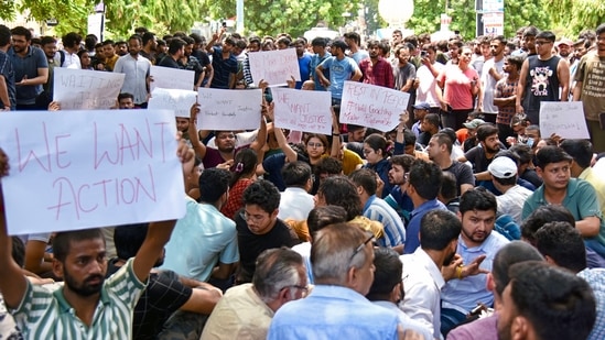 Students in a furious manner stage a protest outside the 'Rau IAS Study Centre' after three civil service aspirants died due to flooding in the basement of the coaching centre, at Old Rajinder Nagar in New Delhi on Sunday. (ANI)