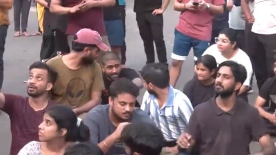 Students protesting outside the coaching centre on Sunday morning (ANI)